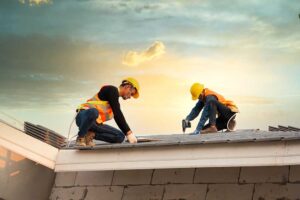 Homeowner reviews a detailed roofing estimate beside a ladder and roof inspection photographs